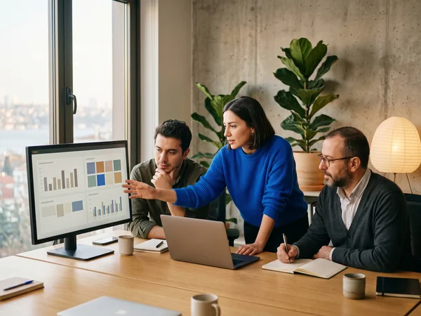 B2B strategist reviewing AI visibility analytics in a modern Istanbul agency office
