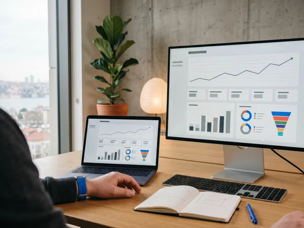 Social media analytics dashboard with engagement and audience growth charts on a laptop screen